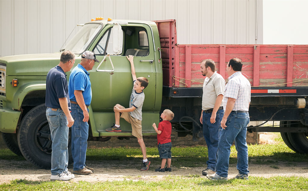 Image of Red Gold tomato growers Middlesworth family from Marion Indiana brothers and son with grandsons