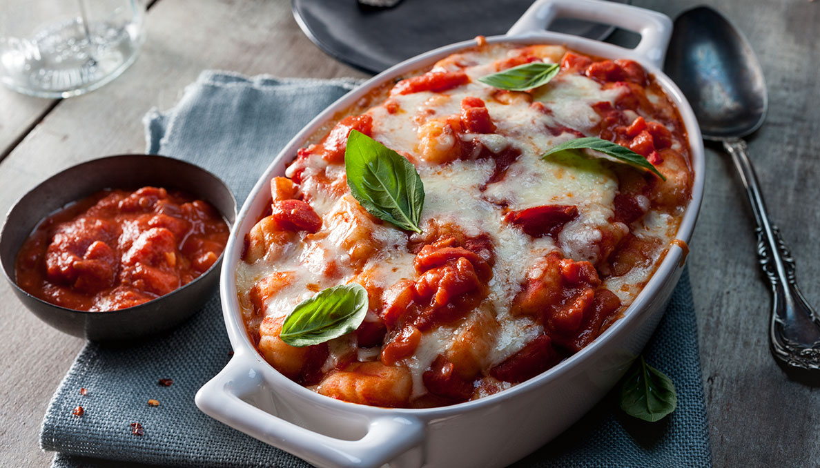 Baked Gnocchi with Cream Pomodoro Sauce and small bowl of tomato sauce