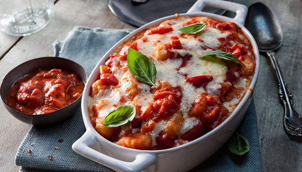 Baked Gnocchi with Cream Pomodoro Sauce and small bowl of tomato sauce