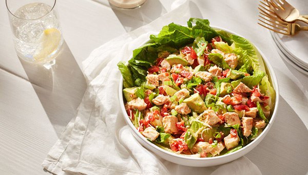 Chipotle Chicken Salad Image of Chipotle Chicken Salad in bowl on white table