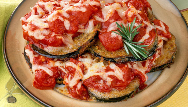 Image of Eggplant Parmesan sliced eggplant diced tomatoes and melted cheese