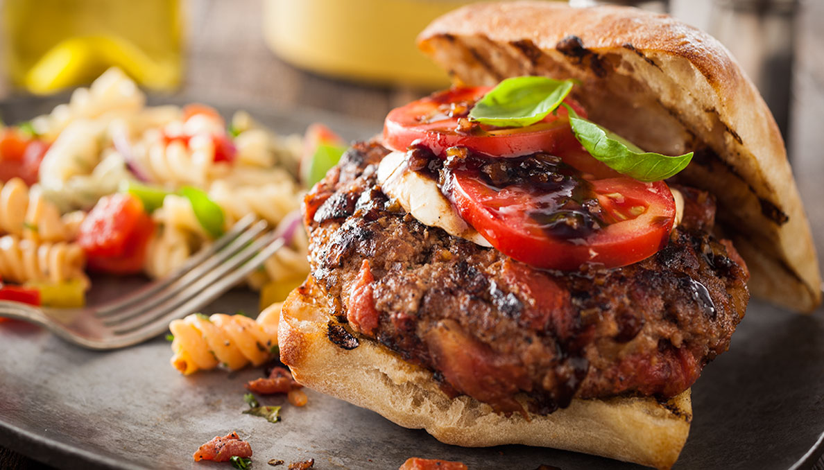 Red white basil burger Image of Red white basil burger side view of burger