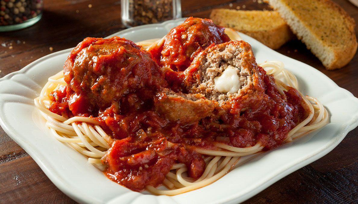 Image of spaghetti and meatballs stuffed with cheese
