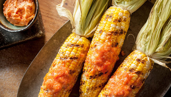 Tomato buter meleted on corn